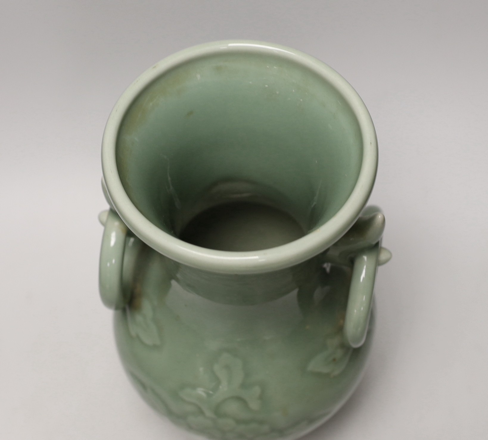 A two handled Chinese celadon glazed vase. 32cm tall
